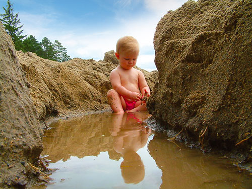 Boy Playing in Sand Valley